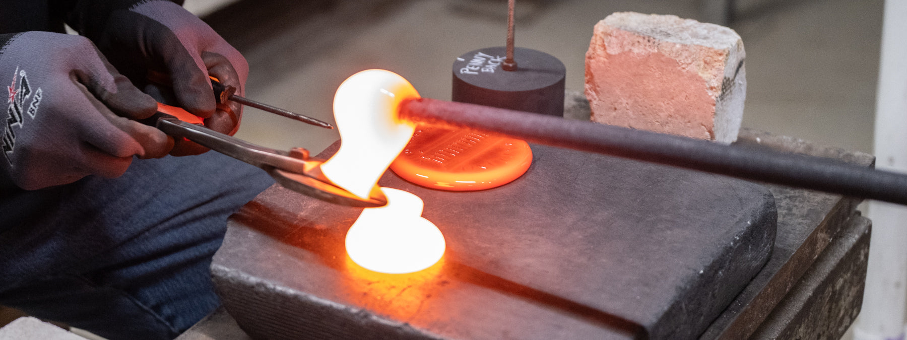 Suncatcher stamping shop working with molten glass