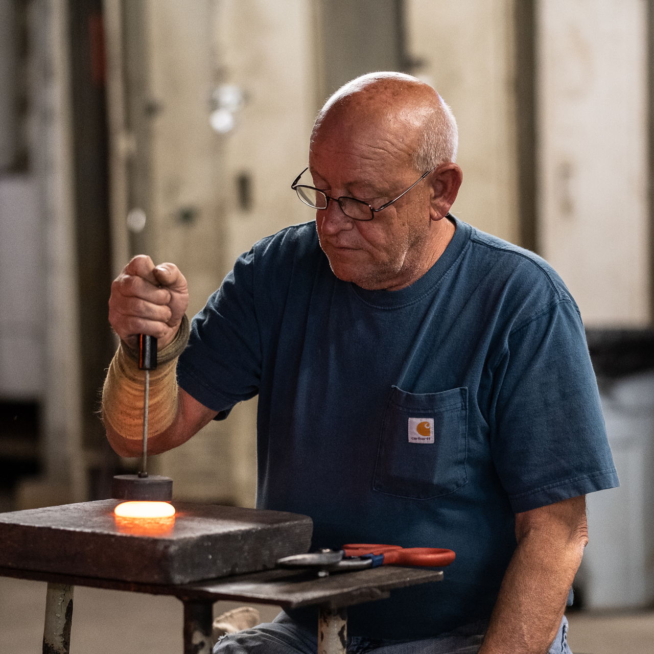 Suncatcher stamping shop working with molten glass