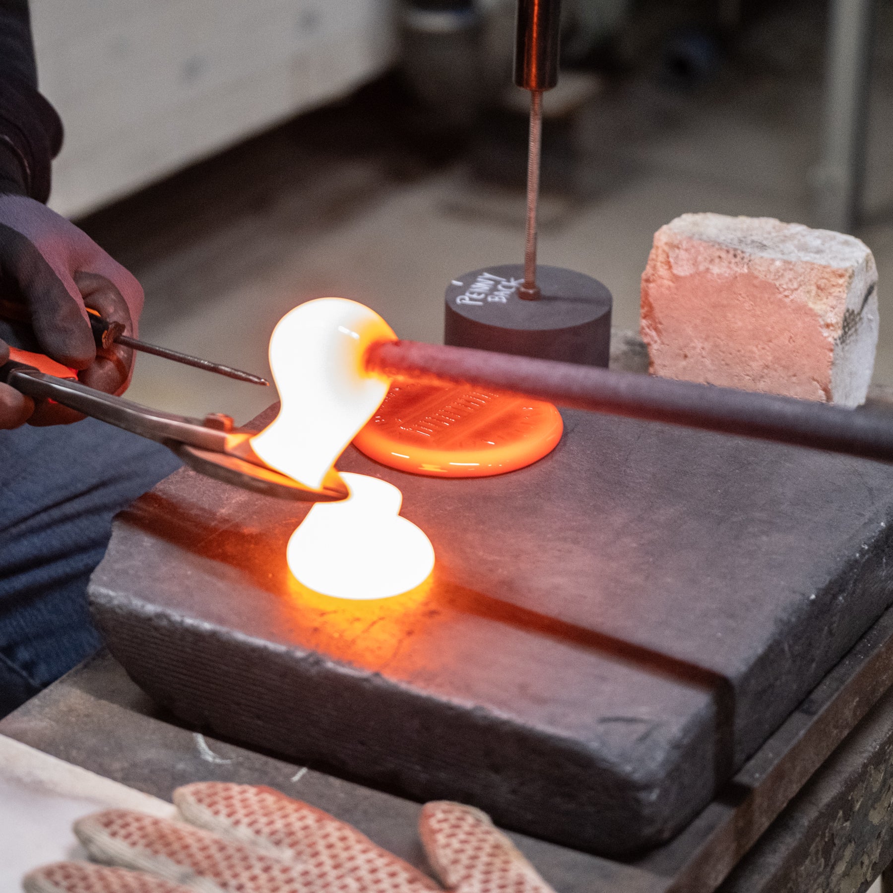 Suncatcher stamping shop working with molten glass