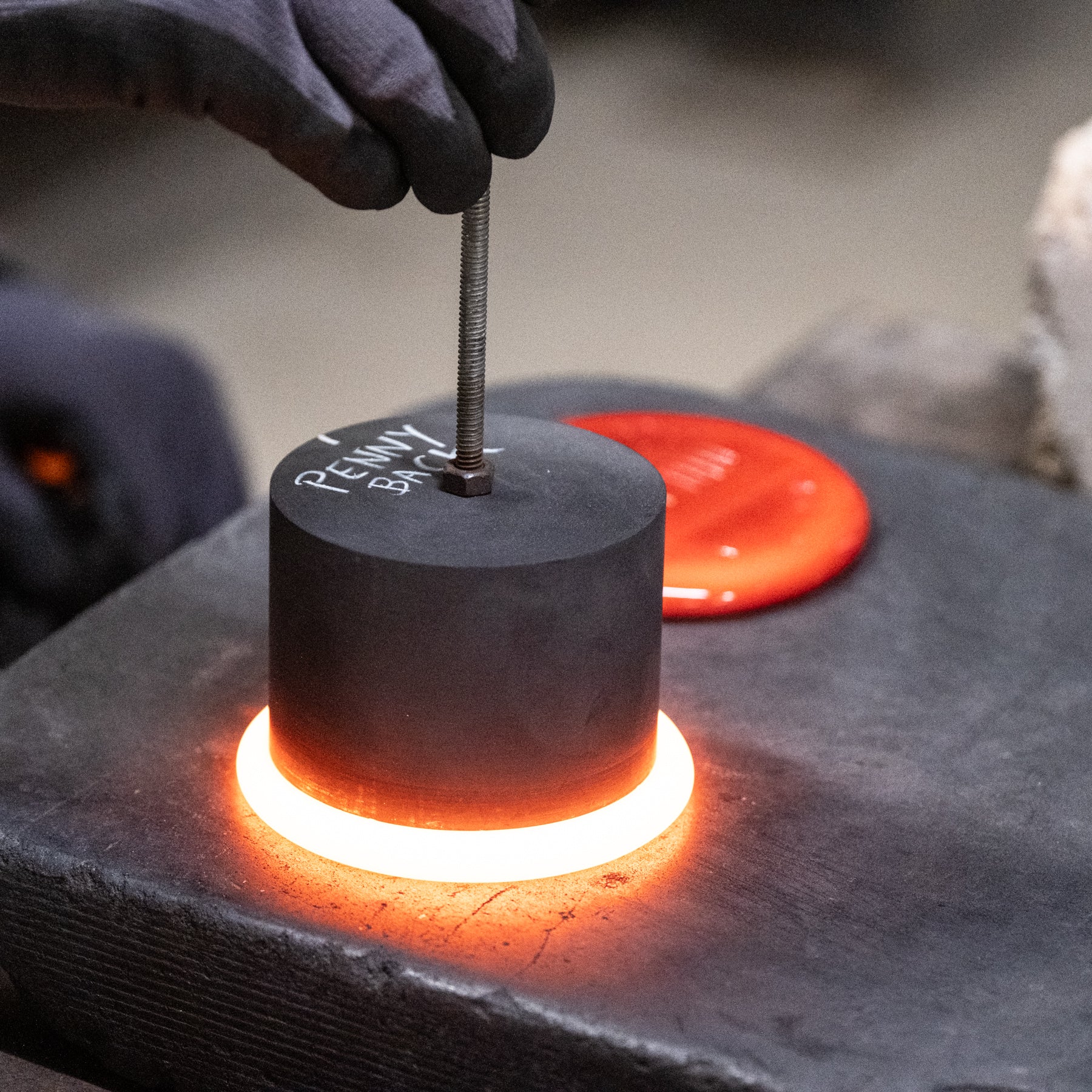 Suncatcher stamping shop working with molten glass